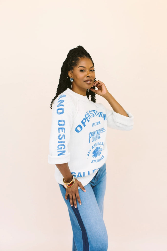 Woman modeling two tone bangles, handmade locally in Charlotte, NC (North Carolina), at a Plaza Midwood woman owned jewelry art and home decor gift shop. A can't miss thing to do - order a housemade vegan chai at The Chai Window to sip while you shop. 