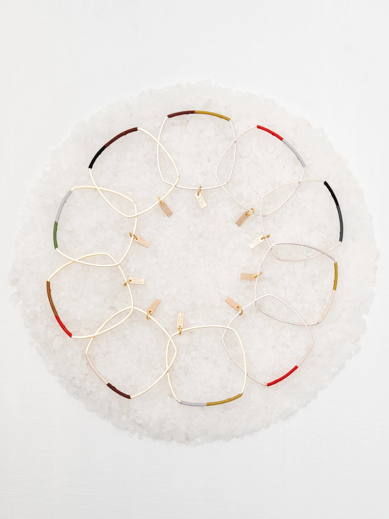 Wrapped bangles for formal and casual wear, handmade locally in Charlotte, NC (North Carolina), at a Plaza Midwood woman owned jewelry art and home decor gift shop. A can't miss thing to do - order a housemade vegan chai at The Chai Window to sip while you shop. 