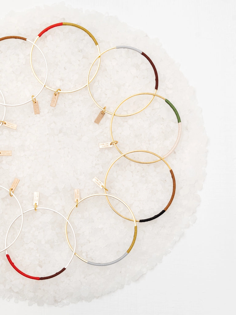 Colorful bangles, handmade locally in Charlotte, NC (North Carolina), at a Plaza Midwood woman owned jewelry art and home decor gift shop. A can't miss thing to do - order a housemade vegan chai at The Chai Window to sip while you shop. 