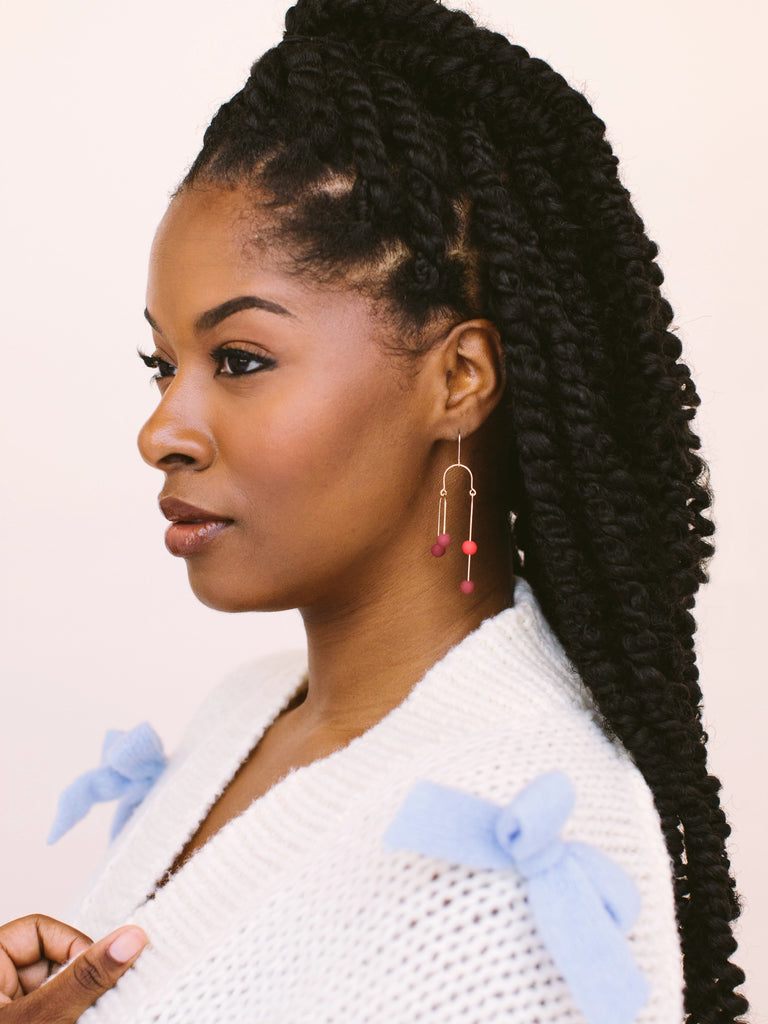 Plum (burgundy/deep purple) and cherry (red) earrings come in gold and silver and are handmade locally in Charlotte, NC (North Carolina), at a Plaza Midwood woman owned jewelry art and home decor gift shop. A can't miss thing to do - order a housemade vegan chai at The Chai Window to sip while you shop. 