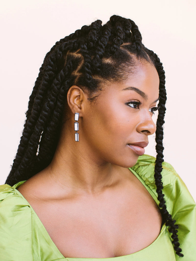 Statement earrings with three stacked rectangles, handmade locally in Charlotte, NC (North Carolina), at a Plaza Midwood woman owned jewelry art and home decor gift shop. A can't miss thing to do - order a housemade vegan chai at The Chai Window to sip while you shop. 