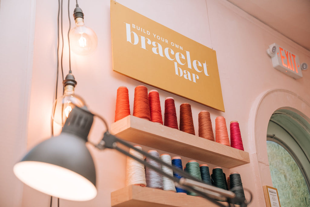 Book the Twenty Two West custom bracelet bar, with products handmade locally in Charlotte, NC (North Carolina), at a Plaza Midwood woman owned jewelry art and home decor gift shop. The bracelet bar is great for your bridal or baby shower, and bachelor/bachelorette parties! A can't miss thing to do - order a housemade vegan chai at The Chai Window to sip while you shop. 