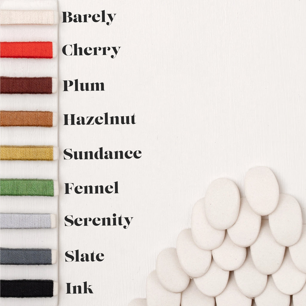 Nine color swatches for wrapped bangles. Barely (white), Cherry (red), Plum (purple), Hazelnut (brown), Sundance (golden), Fennel (green), Serenity (silver), Slate (dark grey), Ink (black)